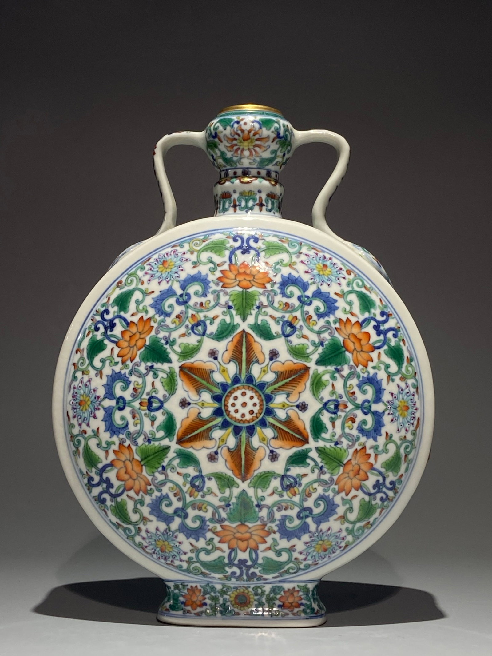 An Exquisite Doucai Painted Gold Lotus Pattern Double-Ears Vase: An Exquisite Doucai Painted Gold Lotus Pattern Double-Ears Vase,Qing Dynasty,China,Qianlong Six-character Mark,Size:11.6inx8.7in 斗彩描金缠枝莲纹双