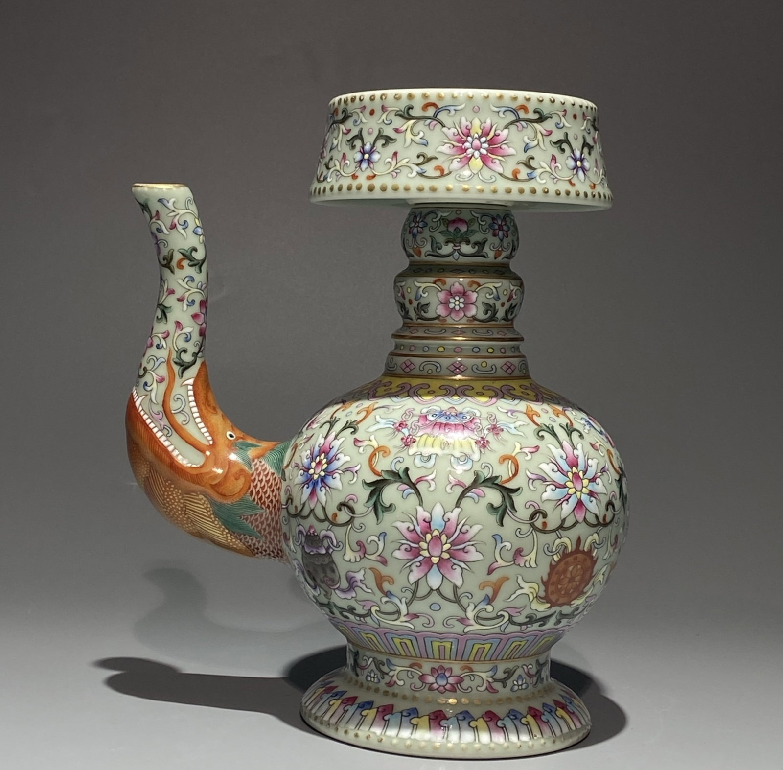 An Exquisite Famille-Rose Painted Gold Lotus and Eight Treasures Pattern Beast-head Pot: An Exquisite Famille-Rose Painted Gold Lotus and Eight Treasures Pattern Beast-head Pot,Qing Dynasty,China,Qianlong Six-character Mark,Size:8.1inx6.7in 粉彩描金缠枝