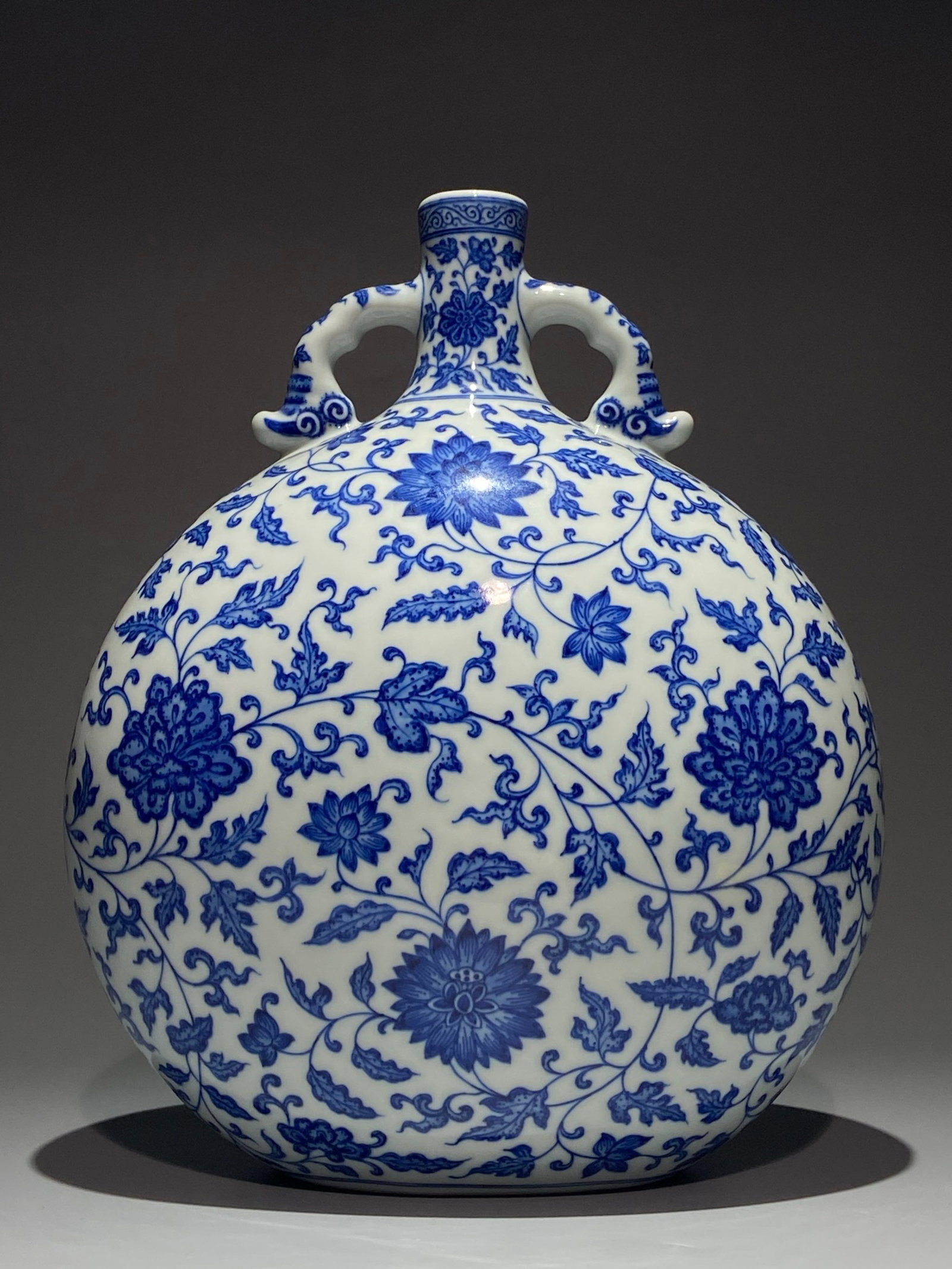 A Rare Blue and White Lotus Pattern Double-Ears Vase: A Rare Blue and White Lotus Pattern Double-Ears Vase,Qing Dynasty,China,Yongzheng Six-character Mark,Size:11.9inx9.8in 青花缠枝莲纹双耳瓶,中