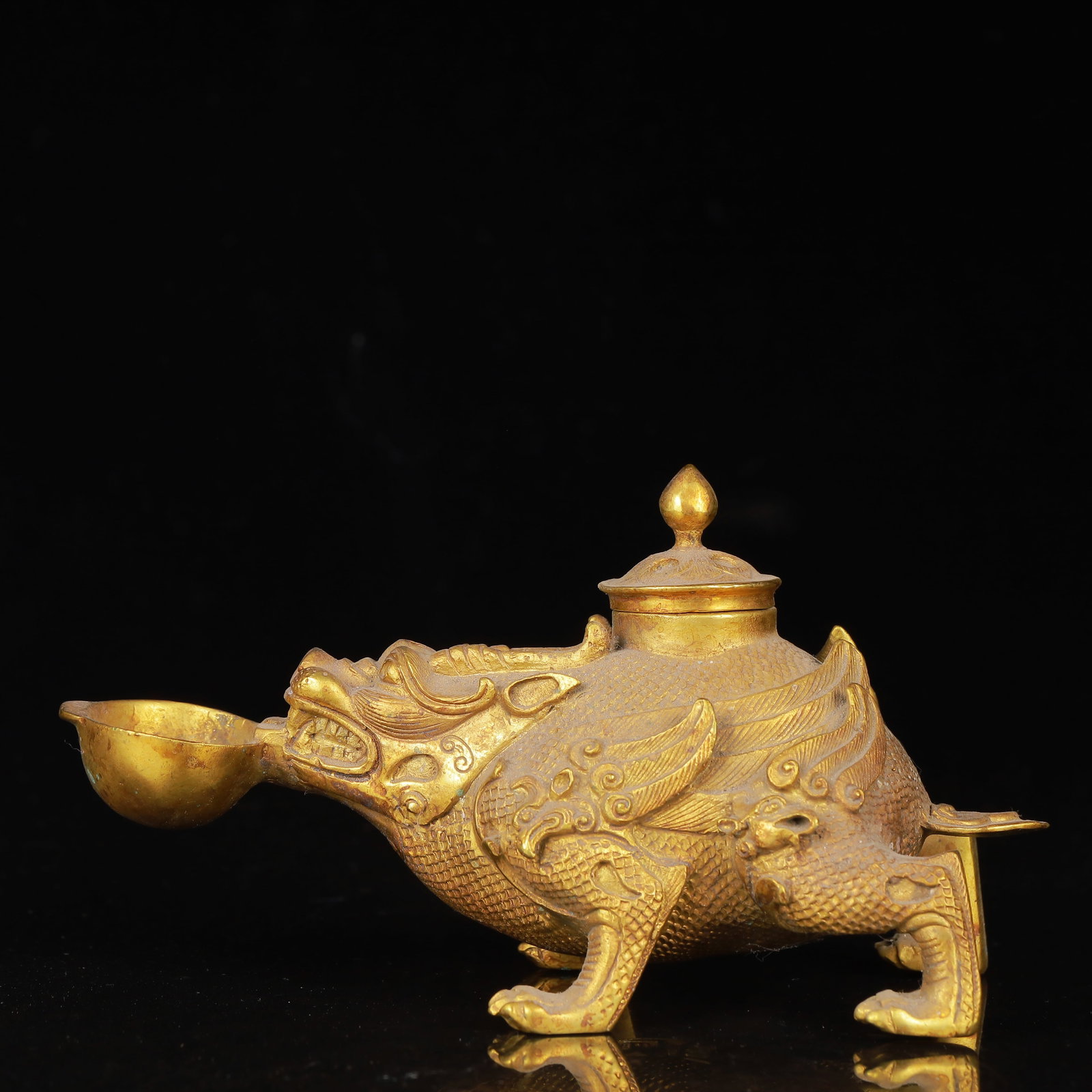 An Exquisite Gilt Bronze Auspicious Beast Ornament: An Exquisite Gilt Bronze Auspicious Beast Ornament,Qing Dynasty,China,Size:6.7inx3.1inx3.5in,Weight:942g 铜鎏金瑞兽摆件,中国清代