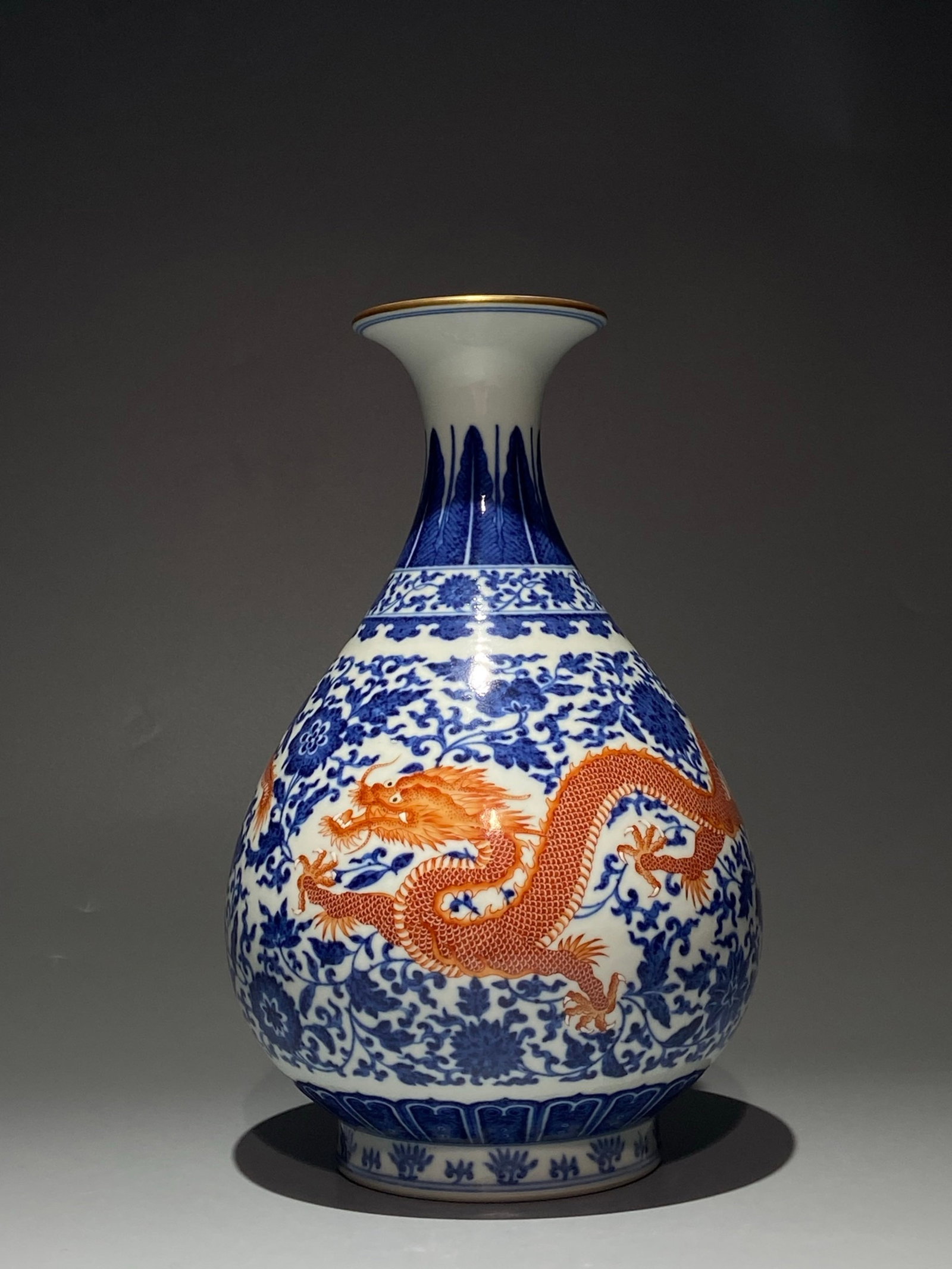 An Exquisite Blue and White Iron-Red Painted Gold Lotus and Dragon Pattern Vase: An Exquisite Blue and White Iron-Red Painted Gold Lotus and Dragon Pattern Vase,Qing Dynasty,China,Yongzheng Six-character Mark,Size:11inx6.7in