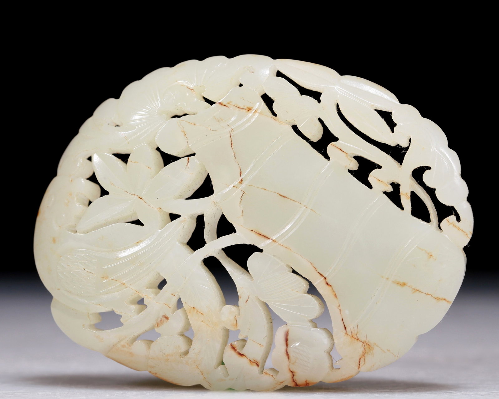 An Excellent White Jade 'Bird& Flower' Pendant: An Excellent White Jade 'Bird& Flower' Pendant. Pierced with a bird with detailed, fine feather incisions stood amidst floral stalks. Chinese Qing Dynasty. Size:2.9inx2.2in 清代 白&#
