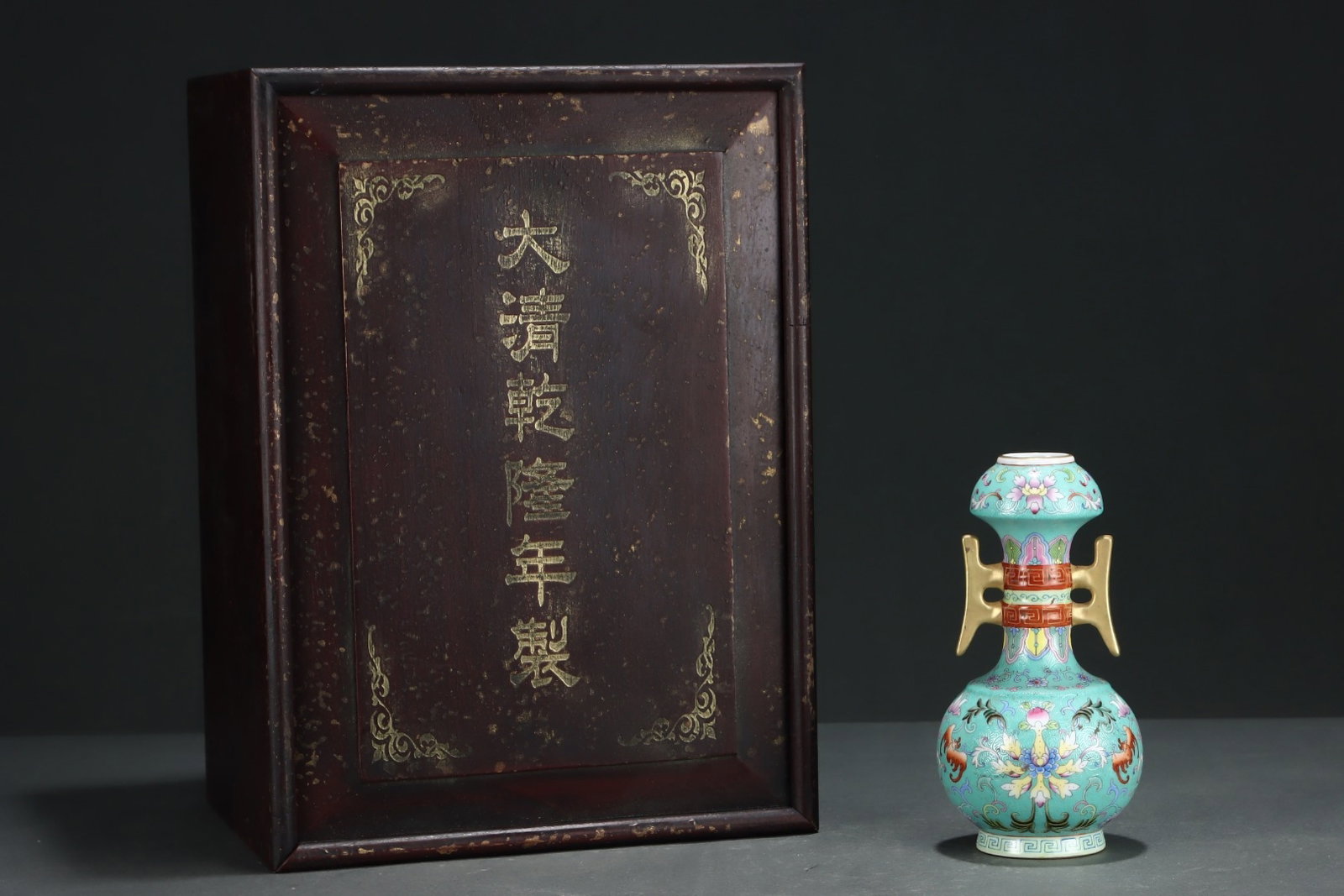 An Exquisite Famille-Rose Turquoise Ground Painted Gold Flower and Bats Pattern Double-Ears Vase: An Exquisite Famille-Rose Turquoise Ground Painted Gold Flower and Bats Pattern Double-Ears Vase,Qing Dynasty, China,Qianlong Four-character Mark,Size:6.9inx3.6in 粉彩松石Ņ