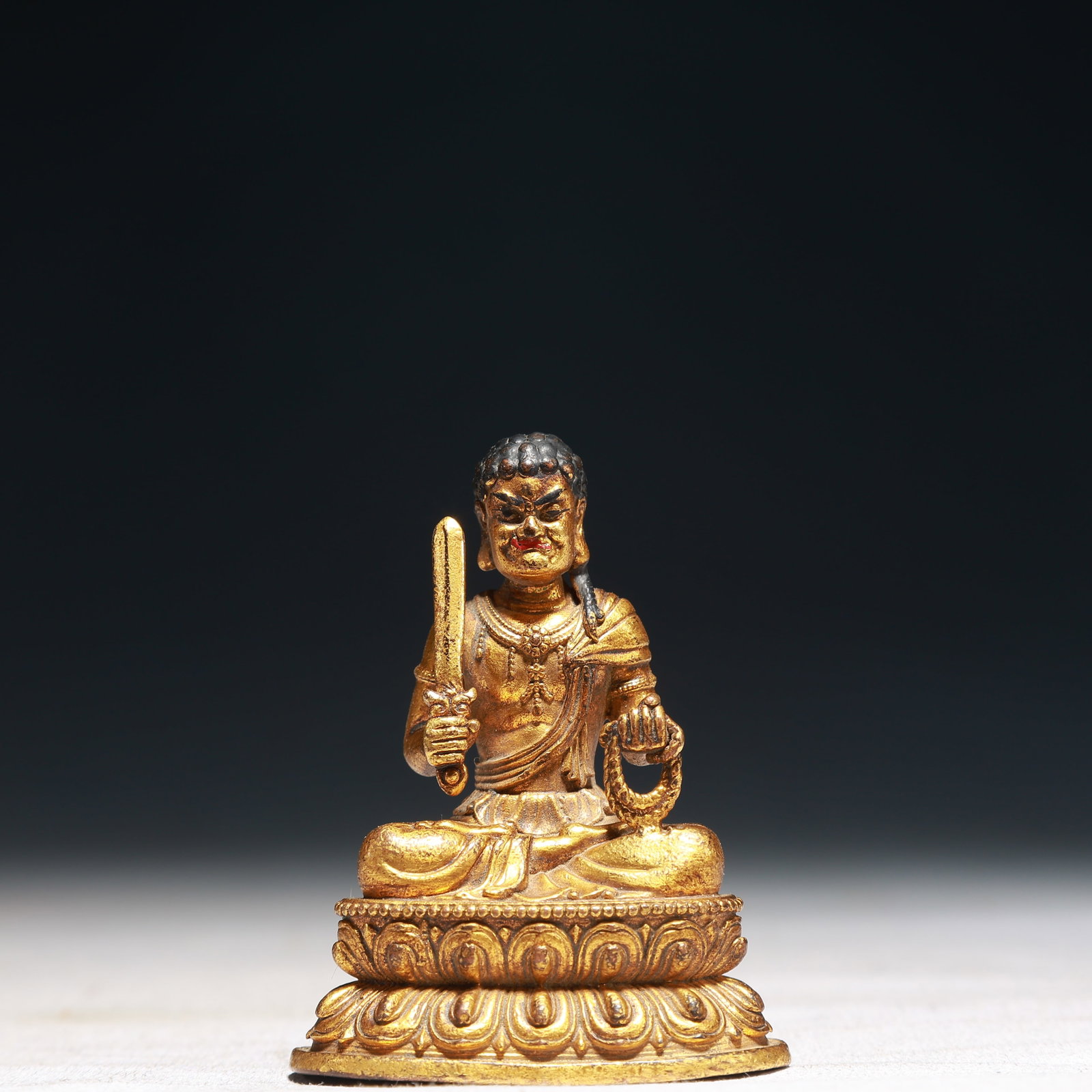 A Solemn Gilt Bronze Buddha Statue: A Solemn Gilt Bronze Buddha Statue,Qing Dynasty,China,Size:2inx1.2inx2.4in,Weight:150g 铜鎏金佛像,中国清代