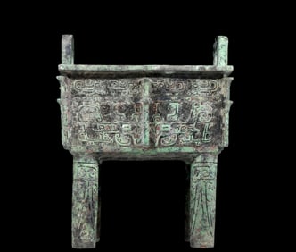 A precious bronze animal-faced tripod with two ears and four legs