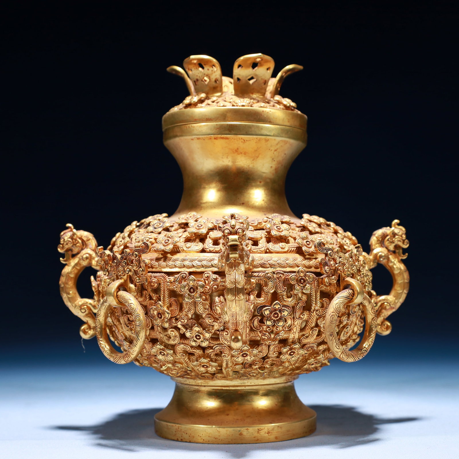 An Exquisite Gilt Bronze Flower Pattern Beast-Ears Jar: An Exquisite Gilt Bronze Flower Pattern Beast-Ears Jar,Qing Dynasty,China,Size:7.9inx8.3inx7.9in,Weight:400g 铜鎏金花卉纹兽耳罐,中国&#
