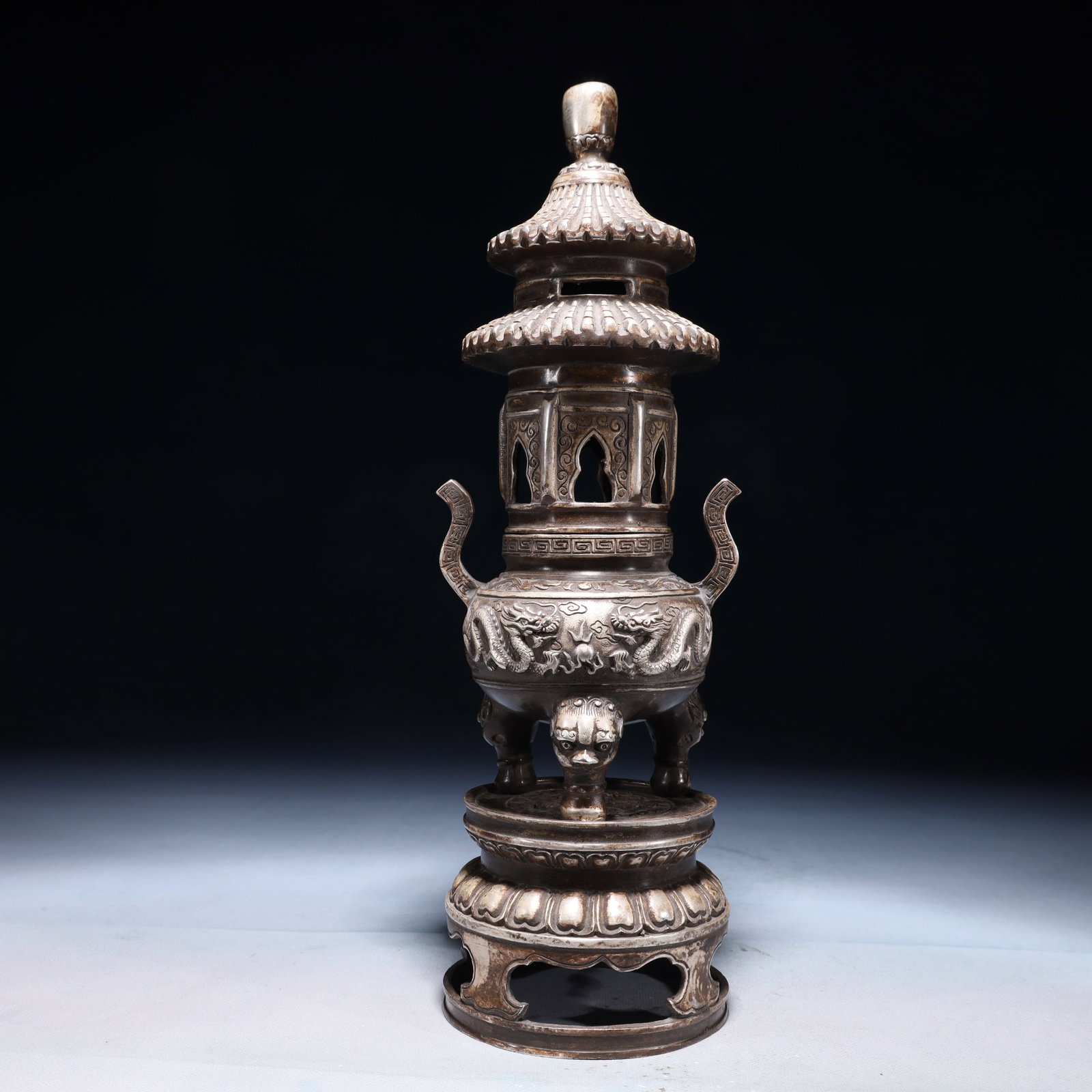 An Exquisite Silver-plated Bronze Auspicious Cloud and Dragon Pattern Double-Ears and Tripod Censer: An Exquisite Silver-plated Bronze Auspicious Cloud and Dragon Pattern Double-Ears and Tripod Censer,Qing Dynasty,China,Qianlong Four-character Mark,Size:4.3inx14.2in,Weight:1550g