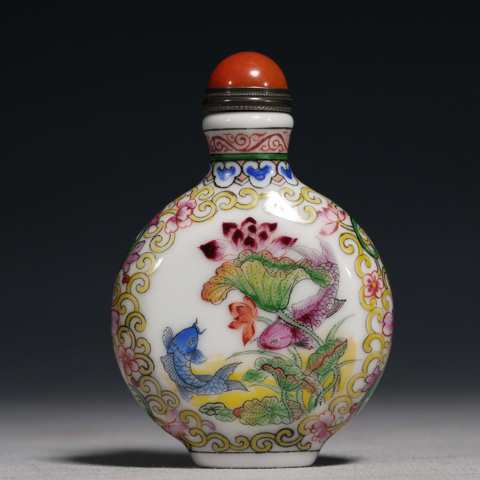 An Exquisite Painted Enamel Lotus and Fish Pattern Porcelain Snuff Bottle: An Exquisite Painted Enamel Lotus and Fish Pattern Porcelain Snuff Bottle,Qing Dynasty,China,Kangxi Four-character Mark,Size:1.8inx0.8inx3.1in 瓷胎画珐琅彩莲&