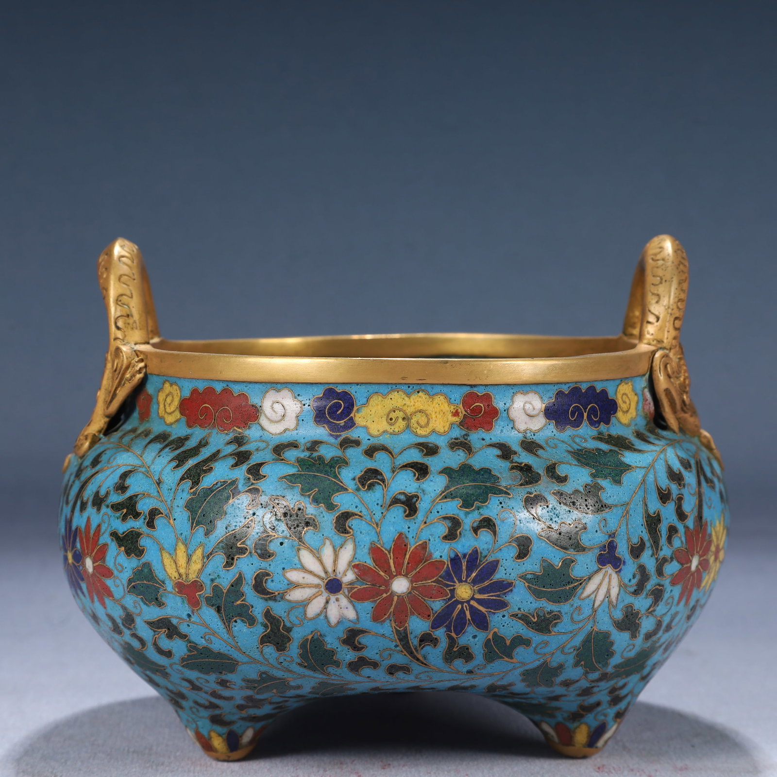 An Exquisite Cloisonne Flower Pattern Dragon-Ears and Tripod Censer: An Exquisite Cloisonne Flower Pattern Dragon-Ears and Tripod Censer,Ming Dynasty, China,Xuande Four-character Mark,Size:5.9inx4.7in,Weight:1000g 景泰蓝花卉纹龙