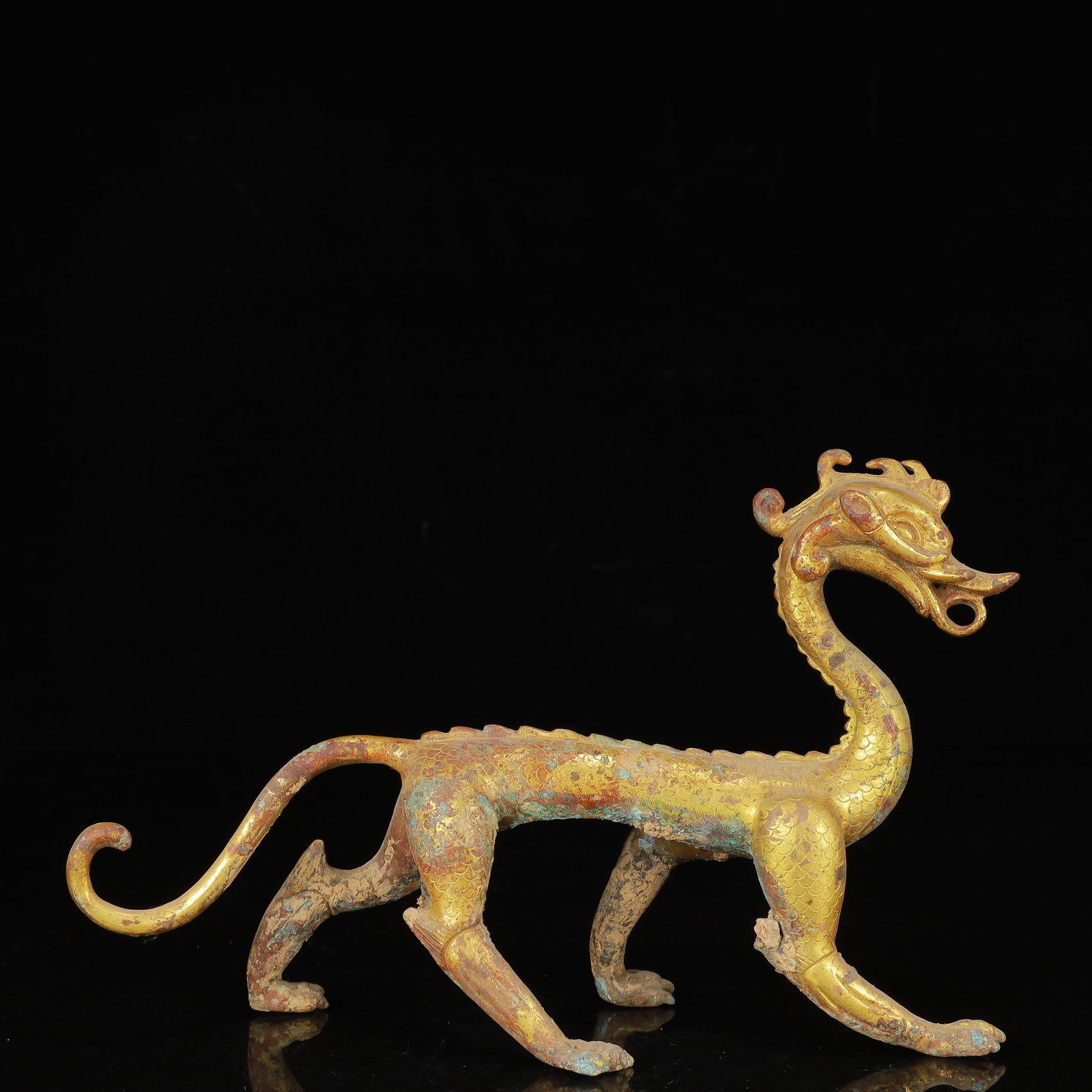 An Exquisite Gilt Bronze Dragon Ornament: An Exquisite Gilt Bronze Dragon Ornament,Qing Dynasty,China,Size:9.1inx2.8inx5.9in,Weight:663g 铜鎏金龙摆件,中国清代