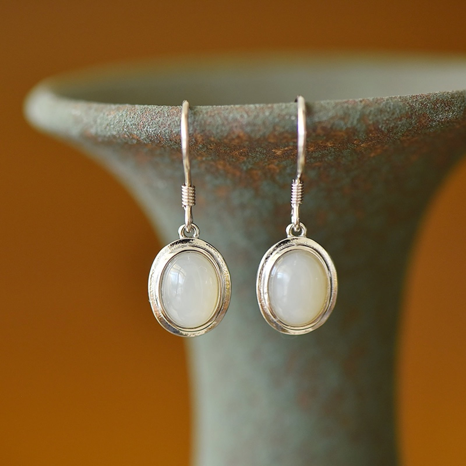 A Pair of Exquisite Sterling Silver Inlaid White Jade Earrings: A Pair of Exquisite Sterling Silver Inlaid White Jade Earrings,Size:6mmx8mm 一对纯银镶白玉耳环