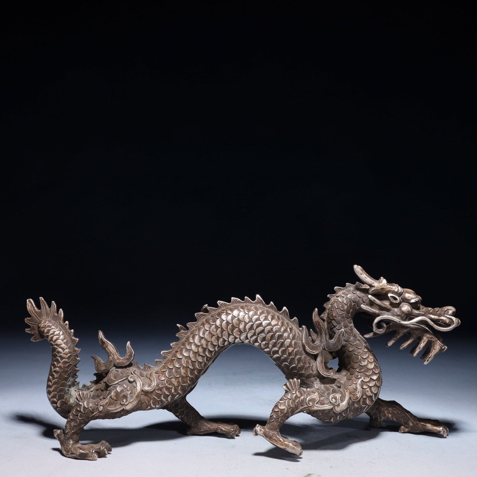 An Exquisite Silver-plated Bronze Dragon Ornament: An Exquisite Silver-plated Bronze Dragon Ornament,Qing Dynasty,China,Size:13.8inx3.1inx5.5in,Weight:1650g 铜镀银龙摆件,中国清代