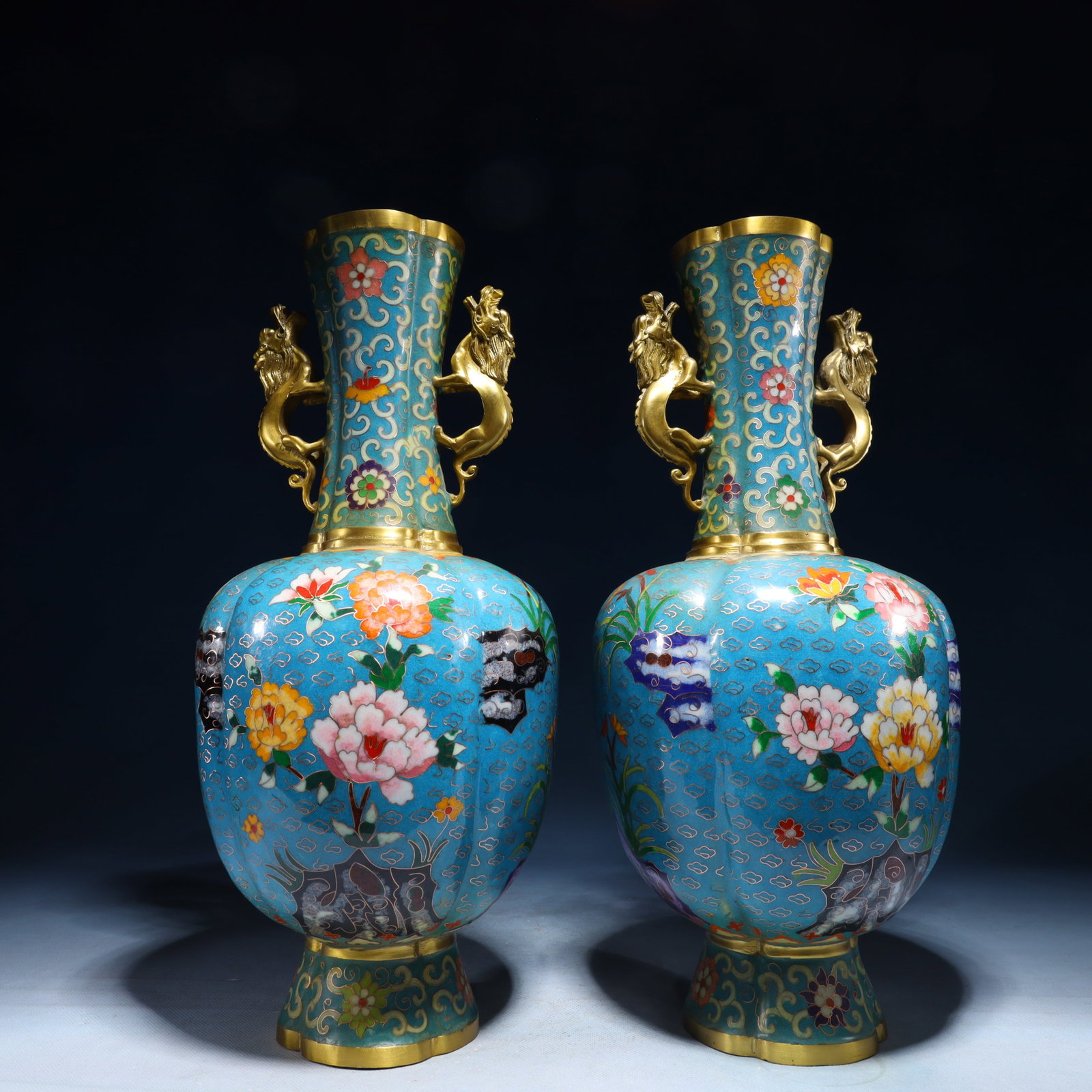A Pair of Exquisite Cloisonne Flower Pattern Double-Ears Vases: A Pair of Exquisite Cloisonne Flower Pattern Double-Ears Vases,Qing Dynasty,China,Qianlong Four-character Mark,Size:6.7inx15.7in,Weight:6950g 一对景泰蓝花卉&#