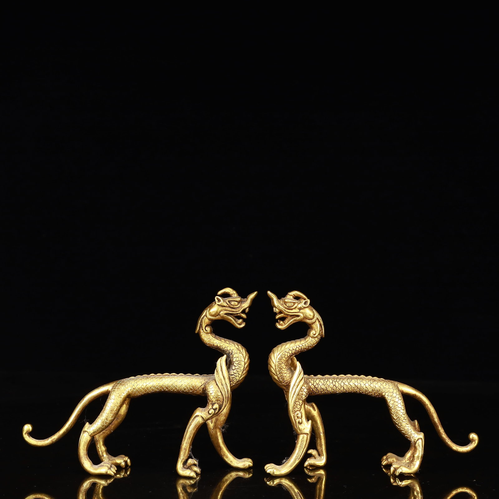 A Pair of Exquisite Gilt Bronze Dragon Ornaments: A Pair of Exquisite Gilt Bronze Dragon Ornaments,Qing Dynasty, China,Size:5.3inx1.6inx4.3in,Weight:450g 一对铜鎏金龙摆件,中国清代