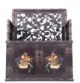 An exquisite zitanwood cabinet with inlaid gemstones and flower and bird patterns