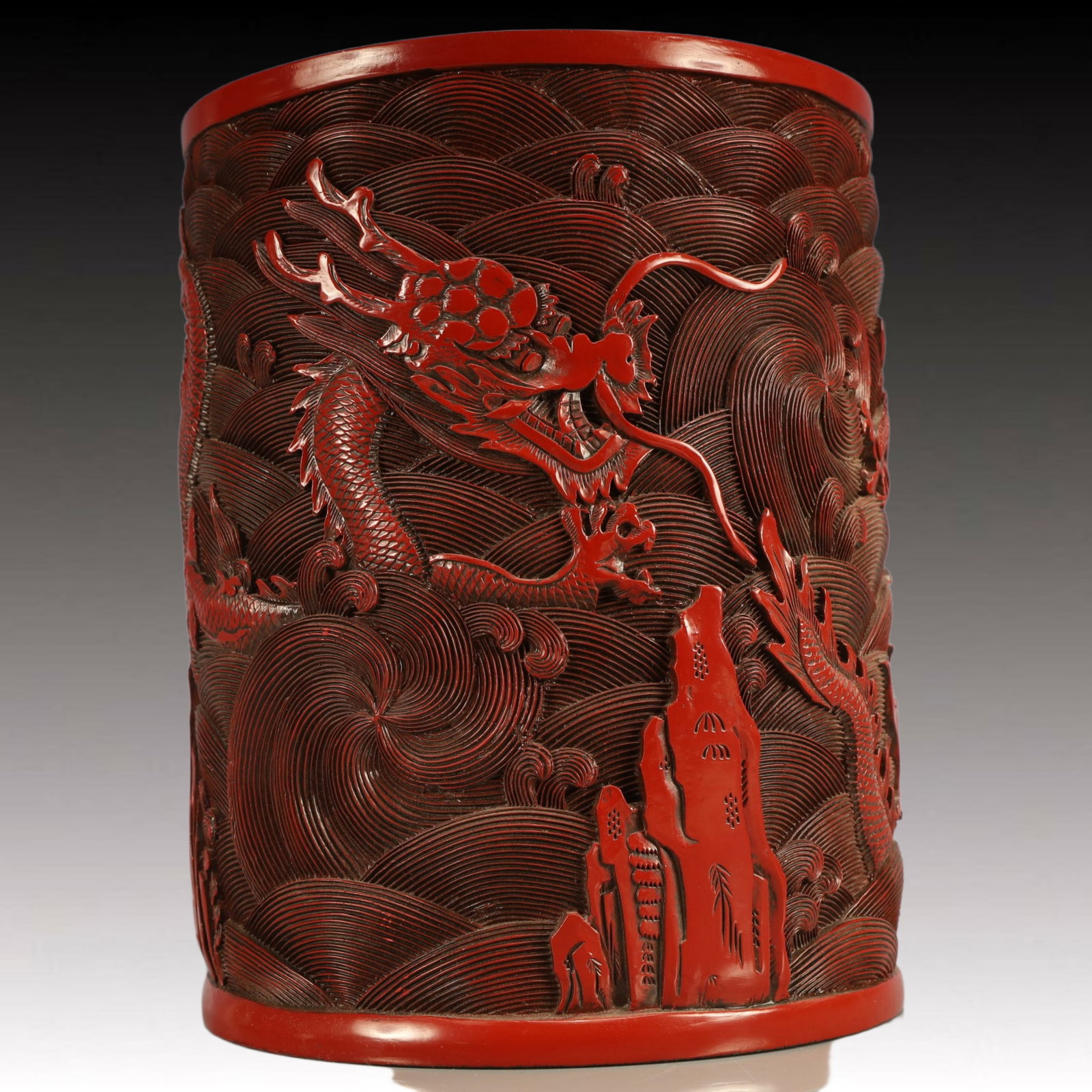 An Exquisite Carved Red Lacquer Seawater and Dragon Pattern Brush Pot,Qing Dynasty, China,Qianlong: An Exquisite Carved Red Lacquer Seawater and Dragon Pattern Brush Pot,Qing Dynasty, China,Qianlong Six-character Mark,Size:7.5inx9.4in,Weight:2850g 剔红漆器海水(