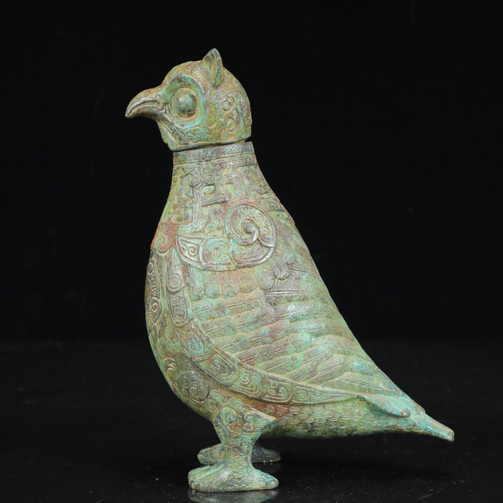 An Archaic Bronze Phoenix Pattern Bird Ornament: An Archaic Bronze Phoenix Pattern Bird Ornament,the Warring States Period in China,Size:5.5inx2.8inx8.3in,Weight:800g 青铜凤纹鸟摆件,中国战&