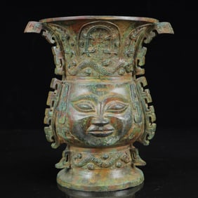 An Archaic Bronze Figure-Face Pattern Four Ears Vase