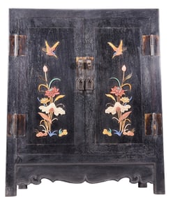 An exquisite zitanwood cabinet with inlaid gemstones and flower and bird patterns