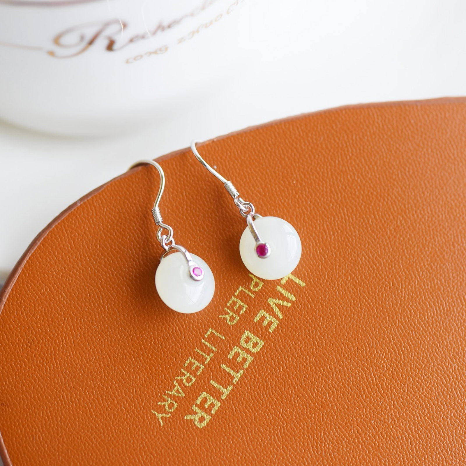 A Pair of Exquisite Sterling Silver Inlaid White Jade Earrings: A Pair of Exquisite Sterling Silver Inlaid White Jade Earrings,Size:11mmx11mm 一对纯银镶白玉耳钉