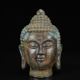 An Archaic Bronze Statue of Sakyamuni Head