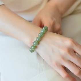 An Exquisite Greenish Jade Bracelets