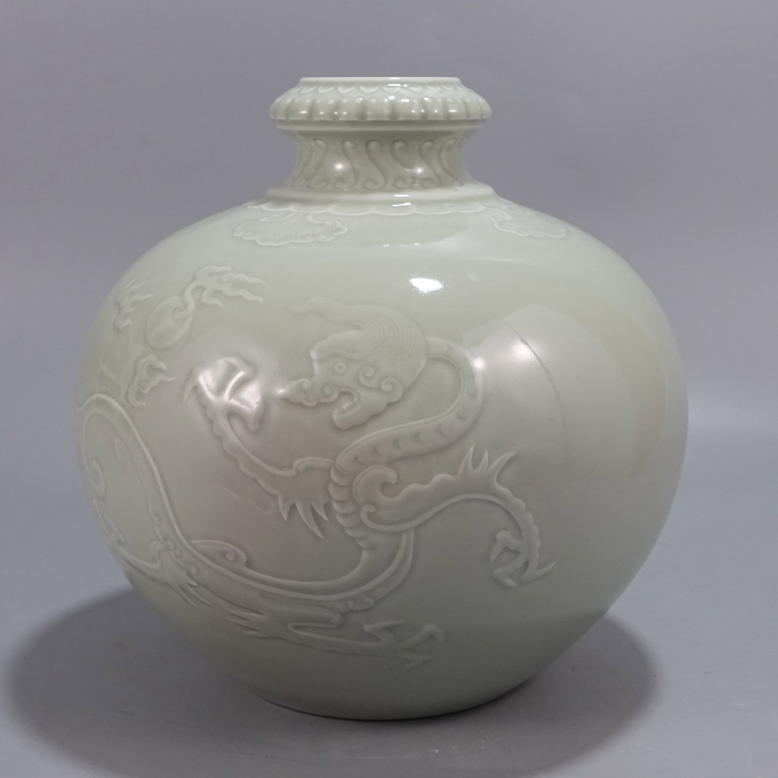An Exquisite Celadon Glazed Dragon Pattern Pomegranate-Shaped Vase: An Exquisite Celadon Glazed Dragon Pattern Pomegranate-Shaped Vase,Qing Dynasty,China,Yongzheng Four-character Mark,Size:9.8inx10in 青釉龙纹石榴形瓶,