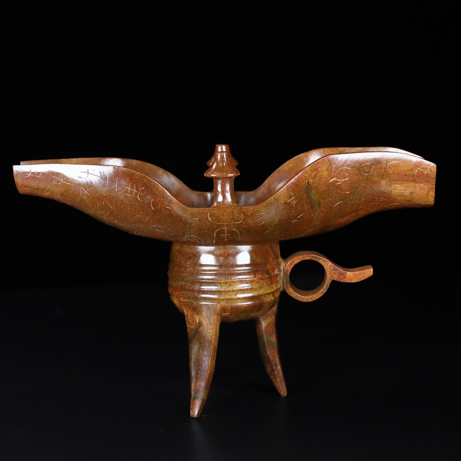 An Exquisite Archaic Jade Tripod Goblet,With Inscription: An Exquisite Archaic Jade Tripod Goblet,With Inscription,Ancient Time,China,Size:9inx3.2inx5.7in,Weight:513g 高古玉三足爵杯,带铭文,中&