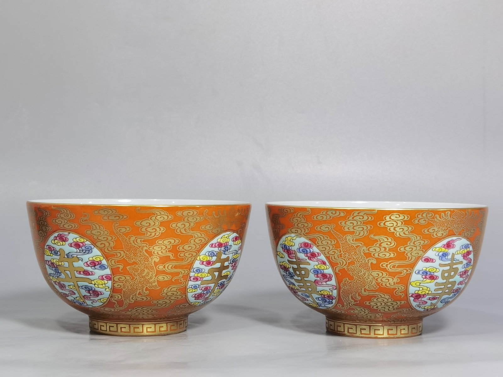 A Pair of Exquisite Coral Red Glazed Famille-Rose Painted Gold Auspicious Cloud Pattern Cups: A Pair of Exquisite Coral Red Glazed Famille-Rose Painted Gold Auspicious Cloud Pattern Cups,Qing Dynasty,China,Yongzheng Four-character Mark,Size:4.2inx2.4in 一对珊瑚红&