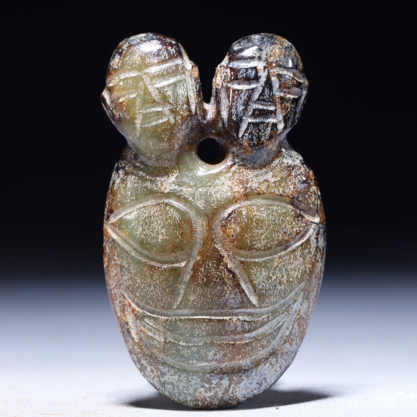 An Archaic Hongshan Culture Greenish Jade Beast-Face Pattern Pendant: An Archaic Hongshan Culture Greenish Jade Beast-Face Pattern Pendant,Ancient Time,China,Size:1.6inx0.4inx2.8in,Weight:67g 红山文化青白玉兽面ಬ