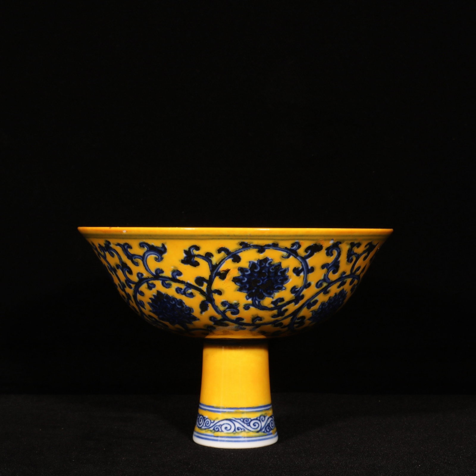 An Exquisite Yellow Glazed Blue and White Lotus Pattern Stem Bowl: An Exquisite Yellow Glazed Blue and White Lotus Pattern Stem Bowl,Ming Dynasty,China,Xuande Six-character Mark,Size:4.5inx6.7in 黄釉青花缠枝莲纹高