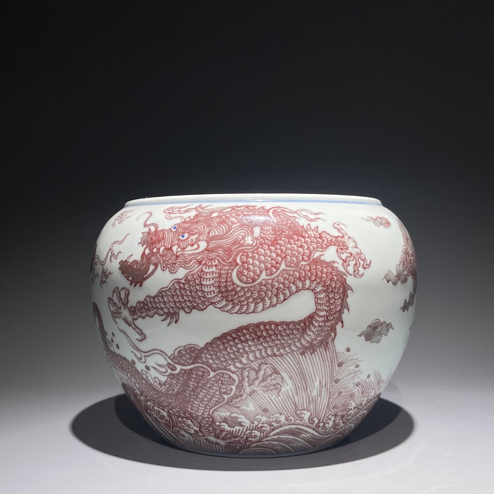 An Exquisite Underglaze-Red Seawater and Dragon Pattern Vat: An Exquisite Underglaze-Red Seawater and Dragon Pattern Vat,Qing Dynasty,China,Kangxi Six-character Mark,Size:7.1inx9.4in 釉里红海水龙纹缸,中Þ