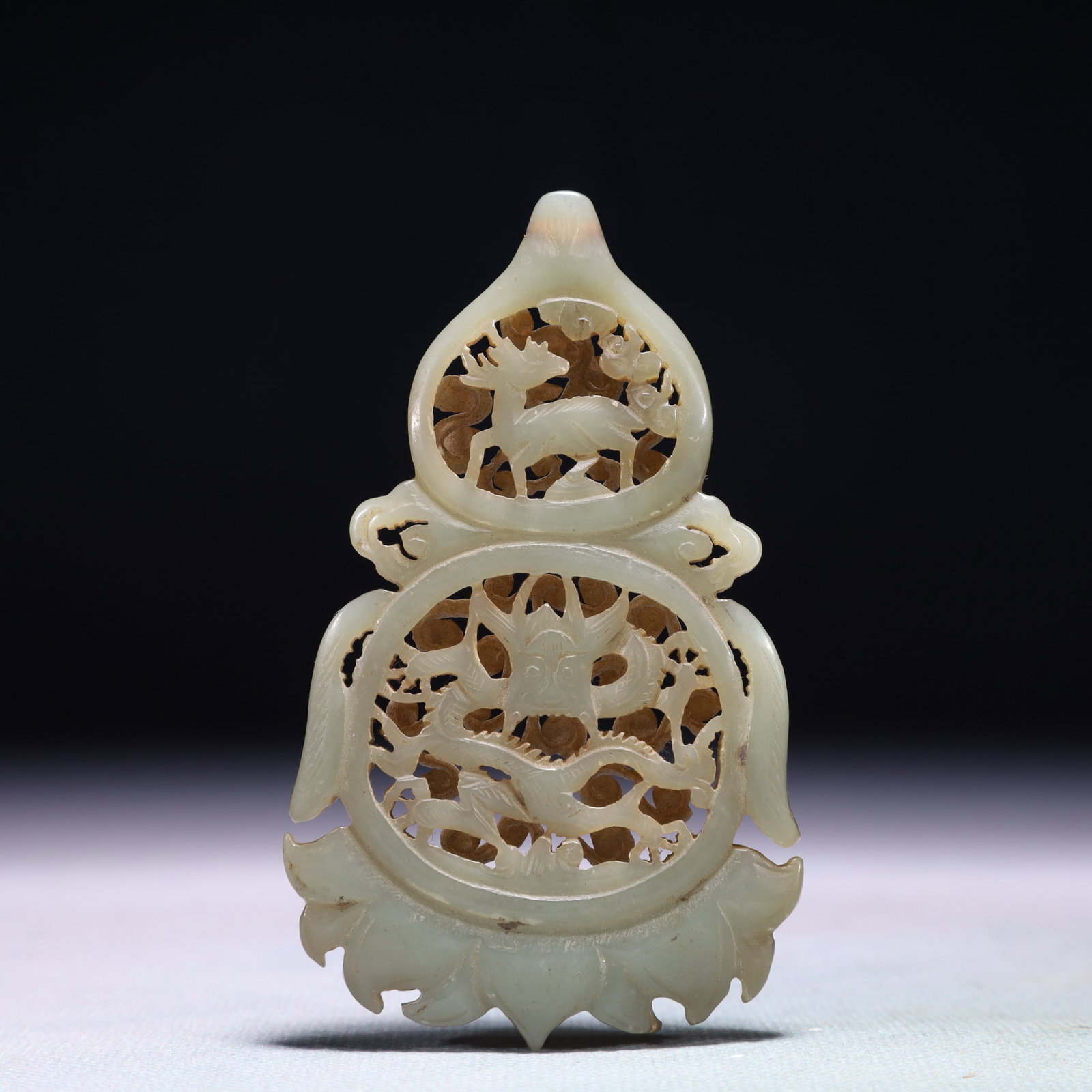 An Exquisite White Jade Auspicious Cloud and Dragon Pattern Pendant: An Exquisite White Jade Auspicious Cloud and Dragon Pattern Pendant,Qing Dynasty,China,Size:2inx3.3in,Weight:41.8g 白玉祥云龙纹佩,中国清