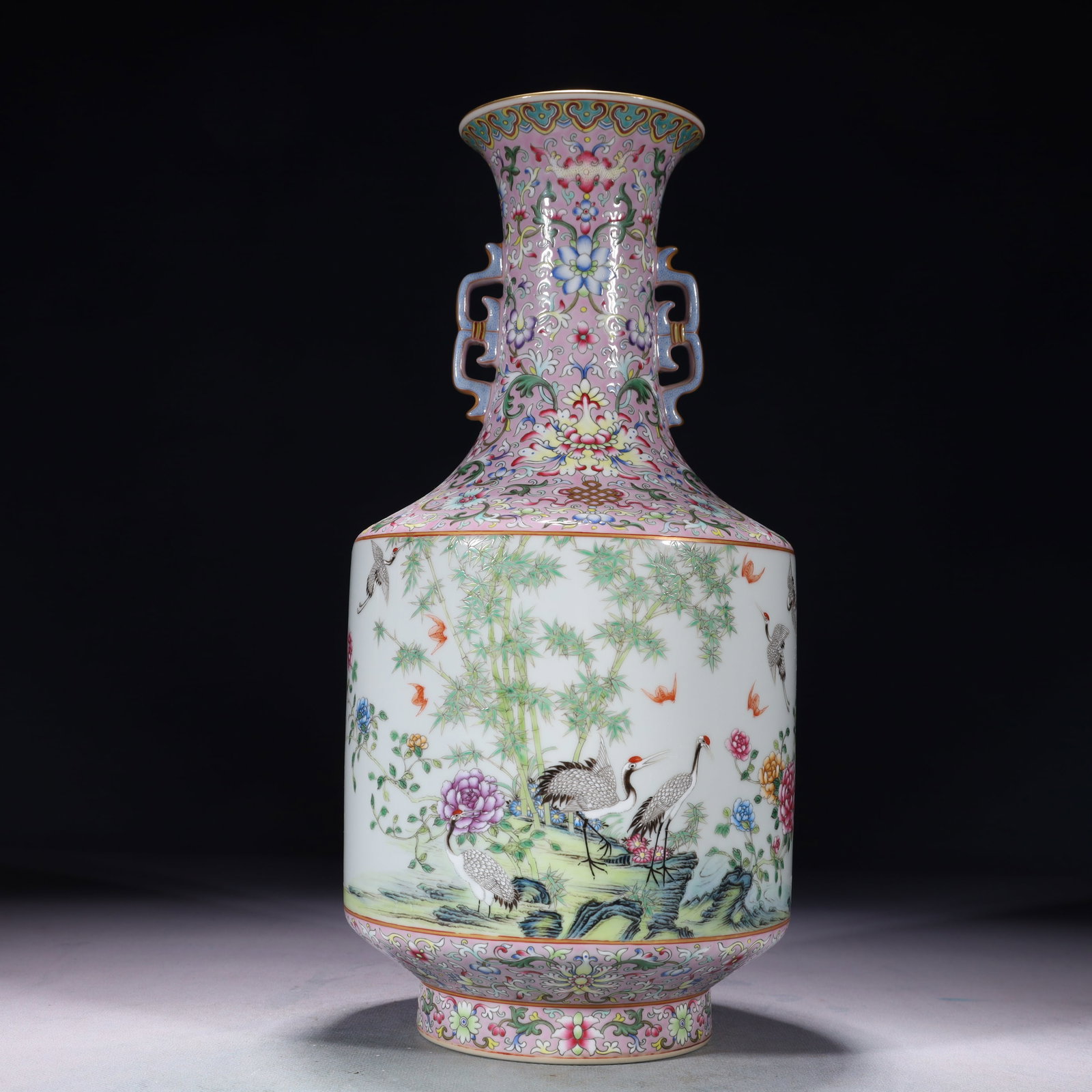 An Exquisite Pink Ground Enamel Painted Gold Flower and Crane Pattern Double-Ears Vase,with poem: An Exquisite Pink Ground Enamel Painted Gold Flower and Crane Pattern Double-Ears Vase,with poem,Qing Dynasty,China,Qianlong Six-character Mark,Size:6.3inx13.4in,Weight:2150g 粉地珐&