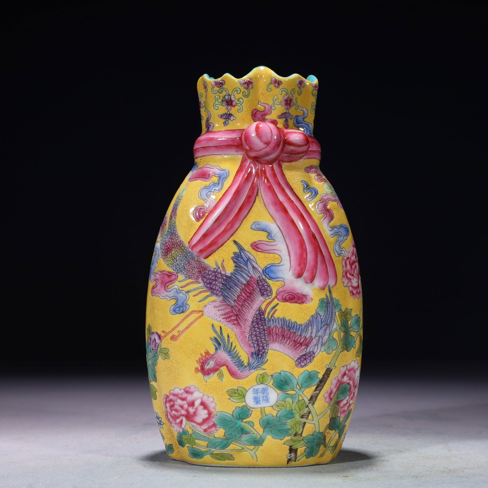 An Exquisite Yellow Ground Famille-Rose Flower and Phoenix Pattern Vase: An Exquisite Yellow Ground Famille-Rose Flower and Phoenix Pattern Vase,Qing Dynasty,China,Qianlong Four-character Mark,Size:3.5inx7.1in,Weight:950g 黄地粉彩花卉