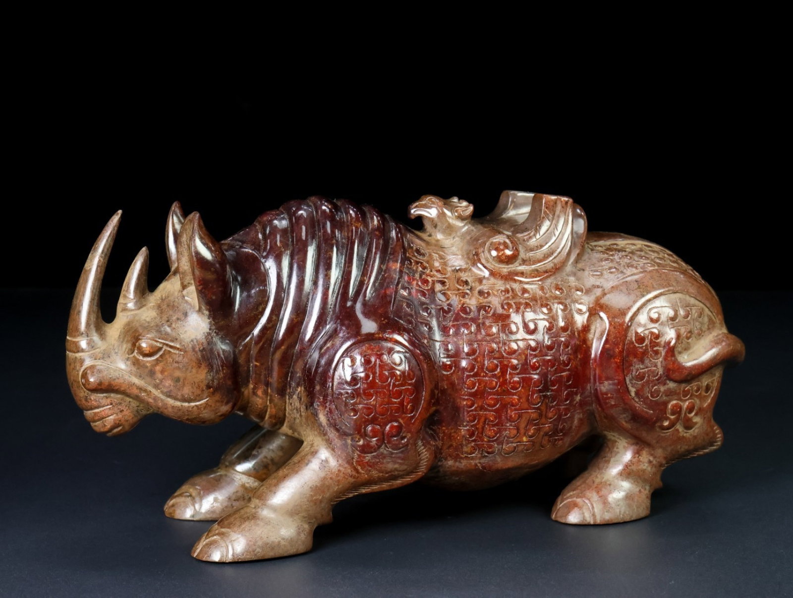 An Exquisite Archaic Jade Rhinoceros Ornament: An Exquisite Archaic Jade Rhinoceros Ornament,Ancient Time,China,Size:8.5inx4.1inx3.1in,Weight:2225g 高古玉犀牛摆件,中国远古时&#