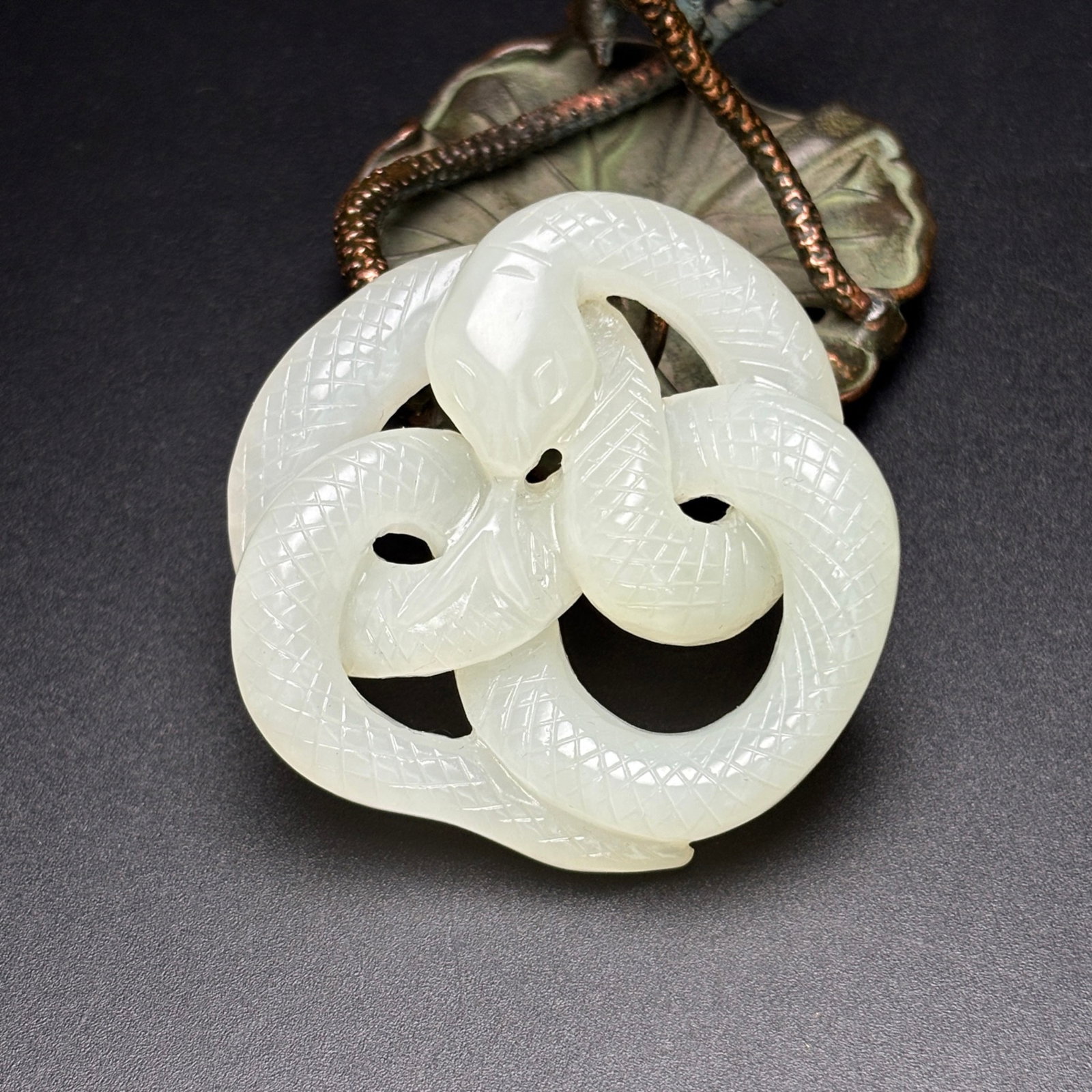 An Exquisite White Jade Snake Patten Pendant: An Exquisite White Jade Snake Patten Pendant,Qing Dynasty,China,Size:1.9inx1.9inx0.5in,Weight:35g 白玉蛇纹佩,中国清代