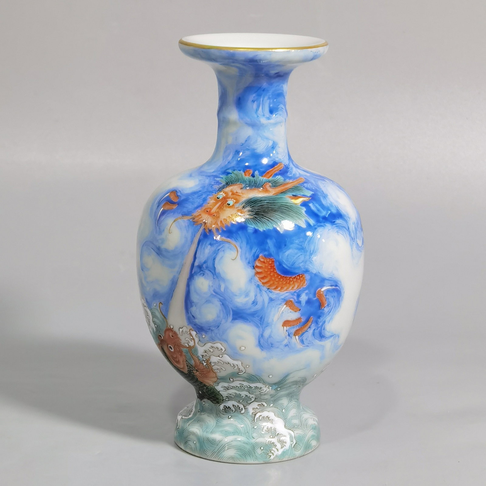 An Exquisite Blue Ground Famille-Rose Painted Gold Seawater and Dragon Pattern Vase: An Exquisite Blue Ground Famille-Rose Painted Gold Seawater and Dragon Pattern Vase,Qing Dynasty,China,Qianlong Six-character Mark,Size:4.9inx2.8in 蓝地粉彩描金