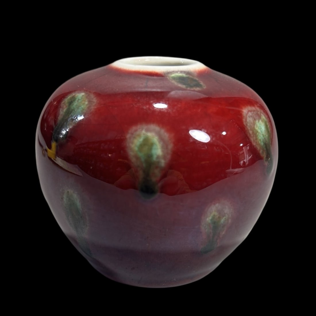 An Exquisite Ji Red Glazed Apple-Shaped Jar (1 of 7)