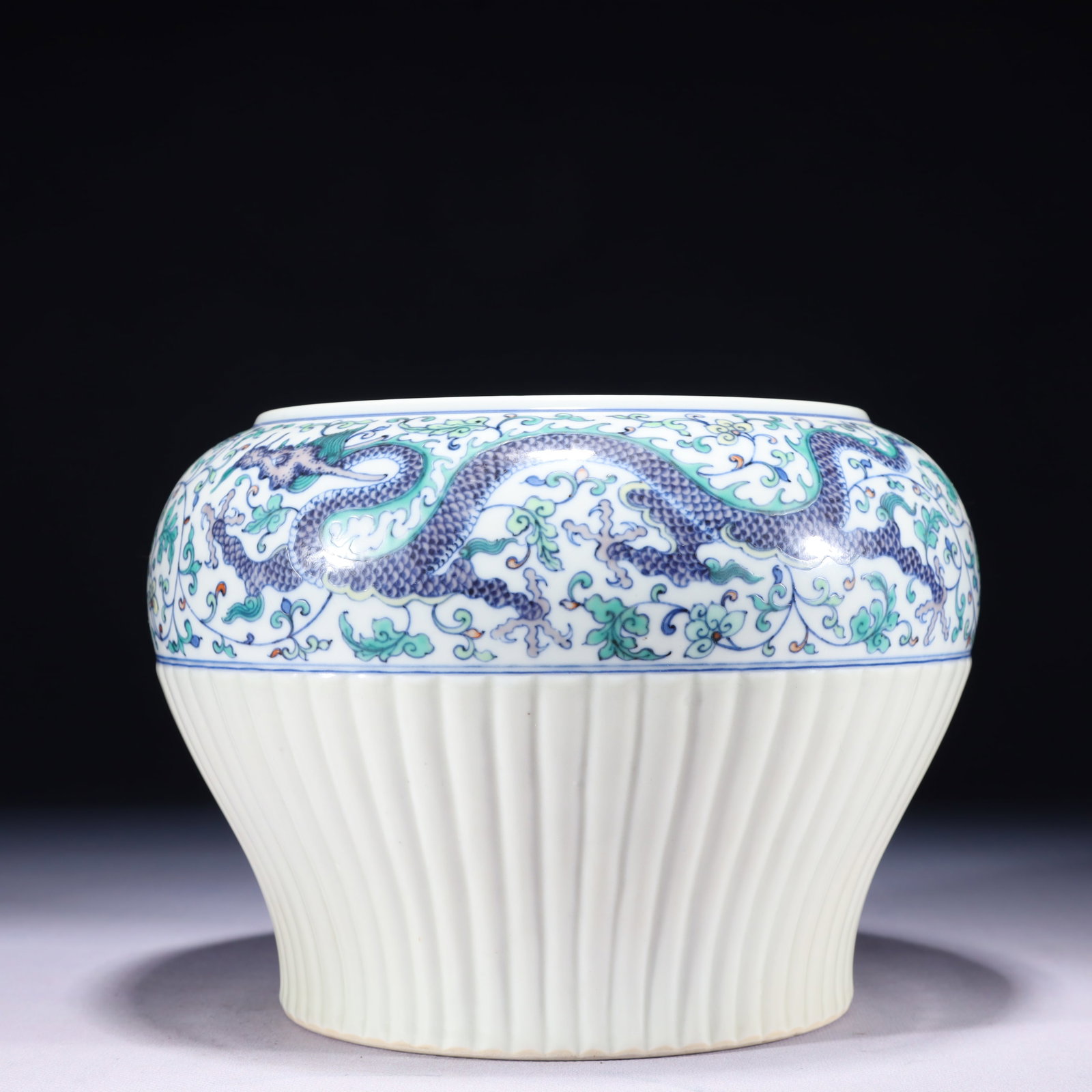 An Exquisite Blue and White Doucai Lotus and Dragon Pattern Jar: An Exquisite Blue and White Doucai Lotus and Dragon Pattern Jar 青花斗彩缠枝莲龙纹罐,中国清代,带款