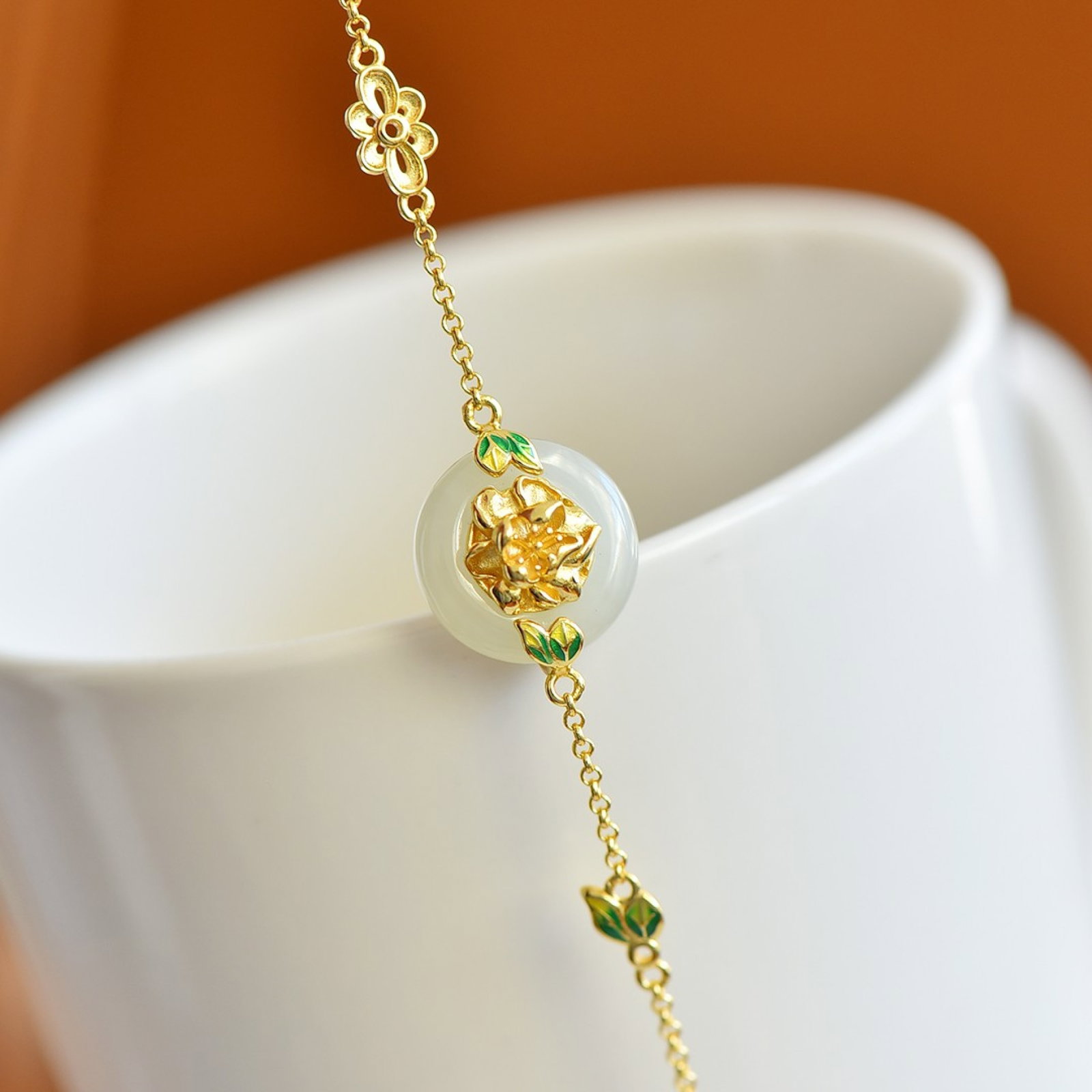 An Exquisite Sterling Silver-Gold Plated Inlaid White Jade Enamel Bracelet: An Exquisite Sterling Silver-Gold Plated Inlaid White Jade Enamel Bracelet,Size:0.6inx0.6in 纯银镀金镶白玉珐琅手链