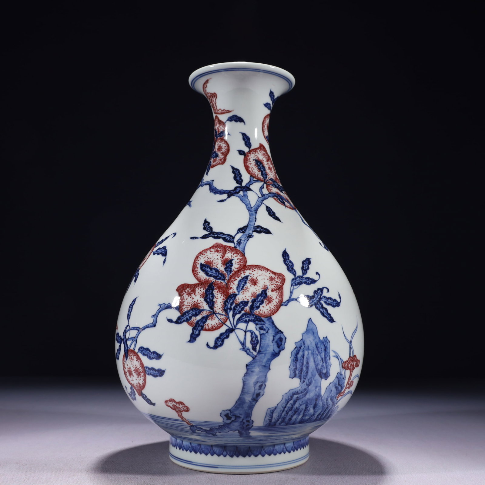 An Exquisite Blue and White Underglaze-Red Bats and Peach Pattern Vase: An Exquisite Blue and White Underglaze-Red Bats and Peach Pattern Vase,Qing Dynasty,China,Qianlong Six-character Mark,Size:6.3inx11.8in,Weight:1650g 青花釉里红福
