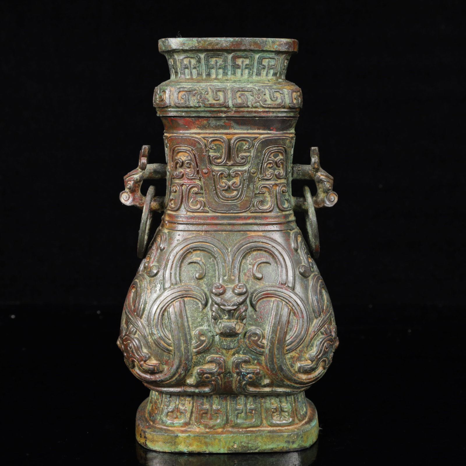 An Archaic Bronze Dragon Pattern Double-Ears Vase: An Archaic Bronze Dragon Pattern Double-Ears Vase,The Warring States period in China,Size:4.7inx3.1inx9.1in,Weight:1850g 青铜龙纹双耳瓶,中国৏