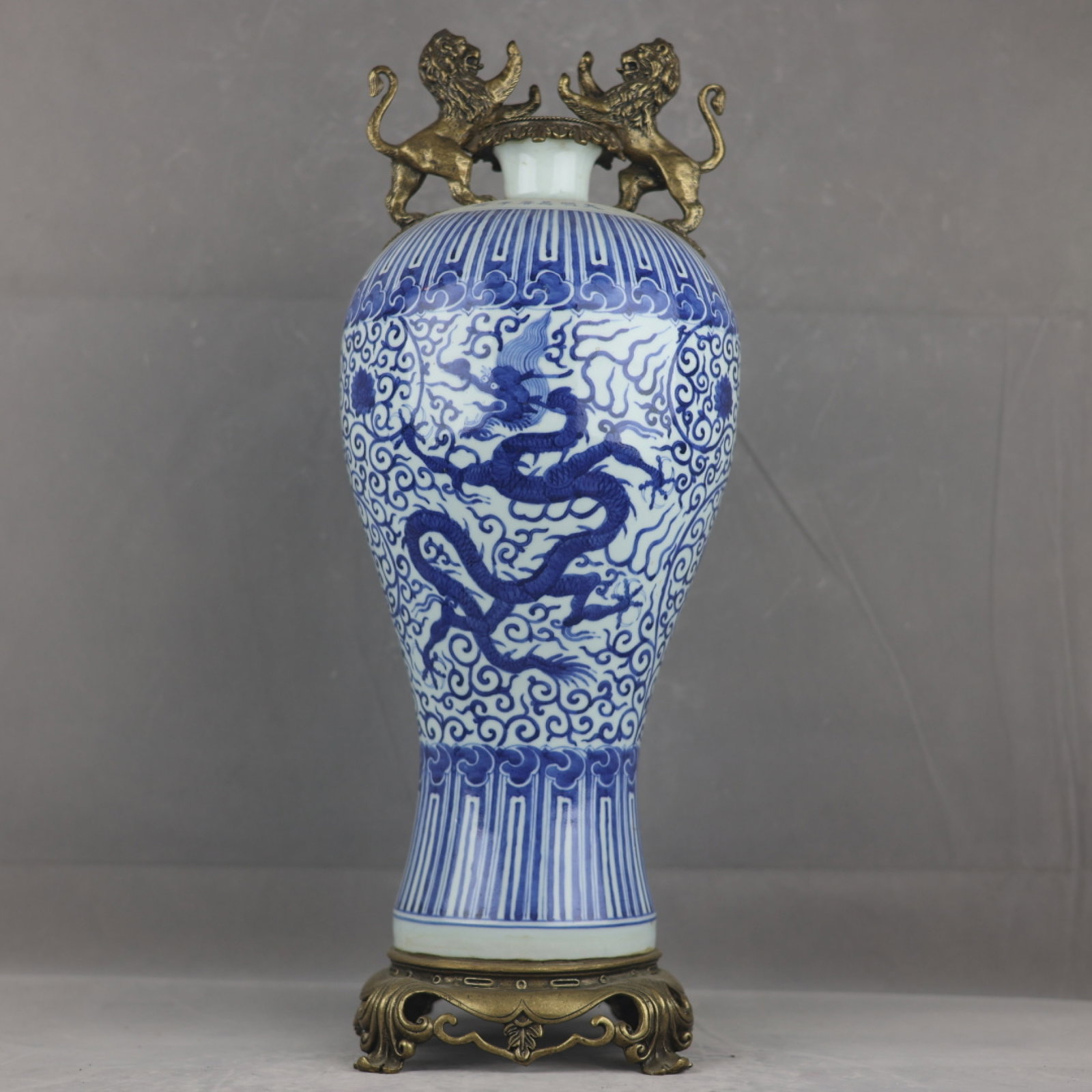 A Huge Blue and White Inlaid Gilt Bronze Lotus and Dragon Pattern Lion-Ears Vase: A Huge Blue and White Inlaid Gilt Bronze Lotus and Dragon Pattern Lion-Ears Vase,Ming Dynasty,China,Wanli Six-character Mark,Size:22.2inx8.3in 青花镶铜鎏金缠&