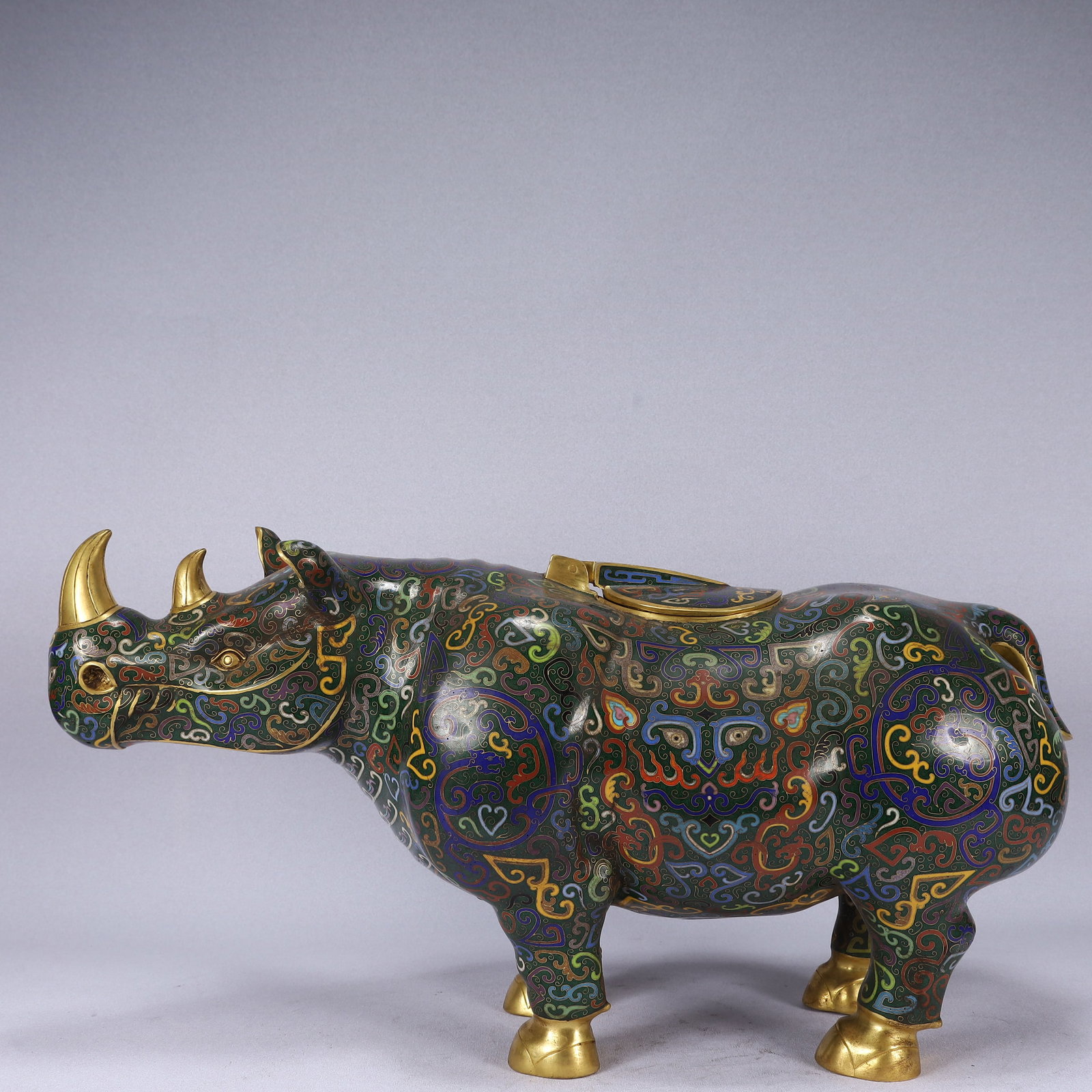 A Huge Cloisonne Beast-Face Pattern Rhinoceros Ornament: A Huge Cloisonne Beast-Face Pattern Rhinoceros Ornament,Qing Dynasty, China,Qianlong Four-character Mark,Size:24inx9.1inx12.6in,Weight:14200g 景泰蓝兽面纹犀&#