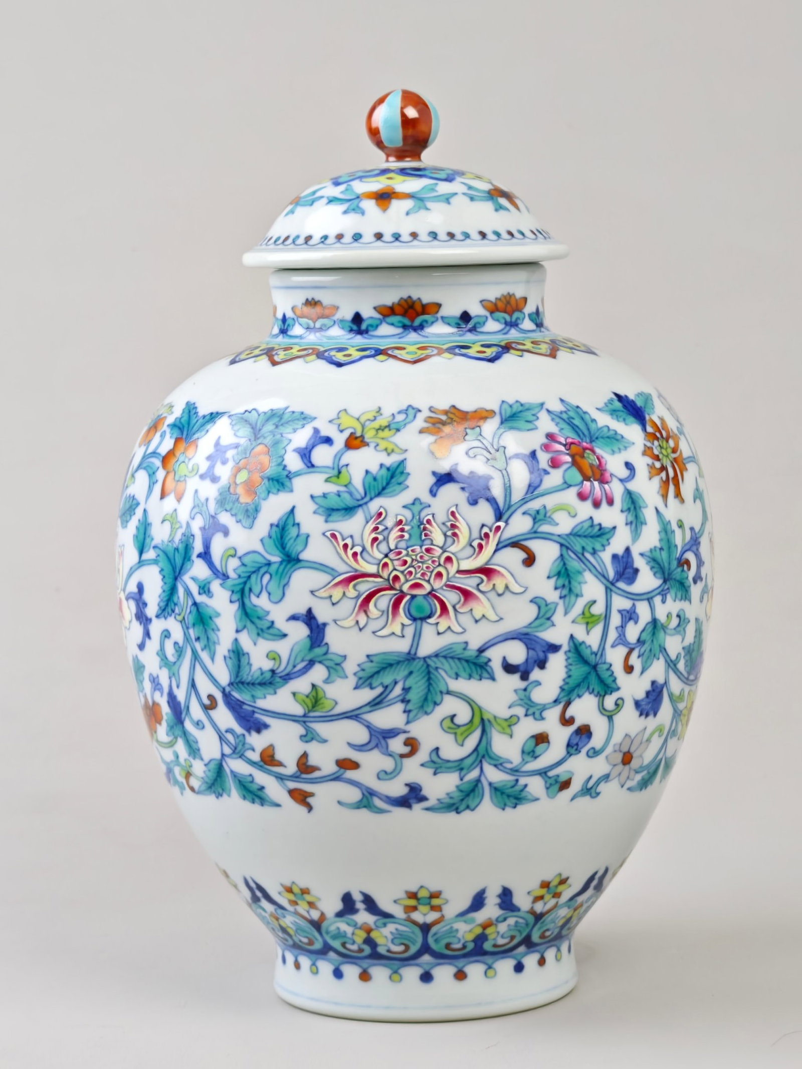 An Exquisite Doucai Lotus Pattern Jar with Cover: An Exquisite Doucai Lotus Pattern Jar with Cover,Qing Dynasty,China,Qianlong Six-character Mark,Size:9.8inx6.7in 斗彩缠枝莲纹盖罐,中国଀