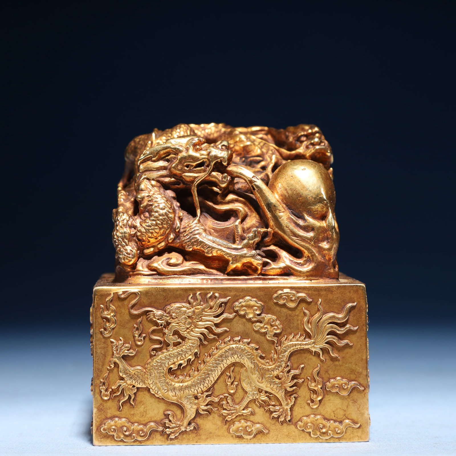 An Exquisite Gilt Bronze Auspicious Cloud and Dragon Pattern Seal: An Exquisite Gilt Bronze Auspicious Cloud and Dragon Pattern Seal,Qing Dynasty,China,Size:3.5inx4.1in,Weight:4100g