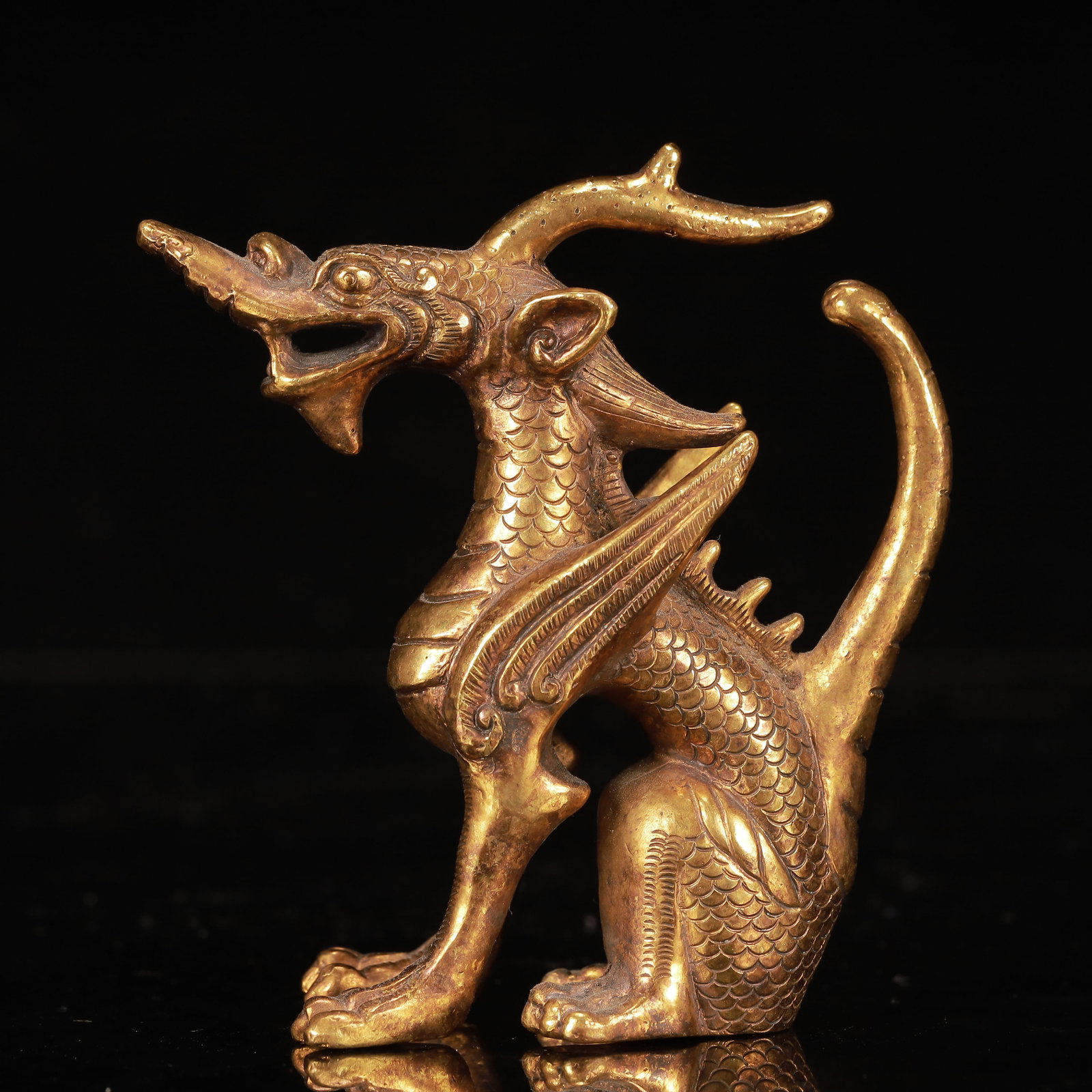 An Exquisite Gilt Bronze Unicorn Ornament: An Exquisite Gilt Bronze Unicorn Ornament,Qing Dynasty, China,Size:3.9inx1.6inx4.3in,Weight:400g 铜鎏金独角兽摆件,中国清代