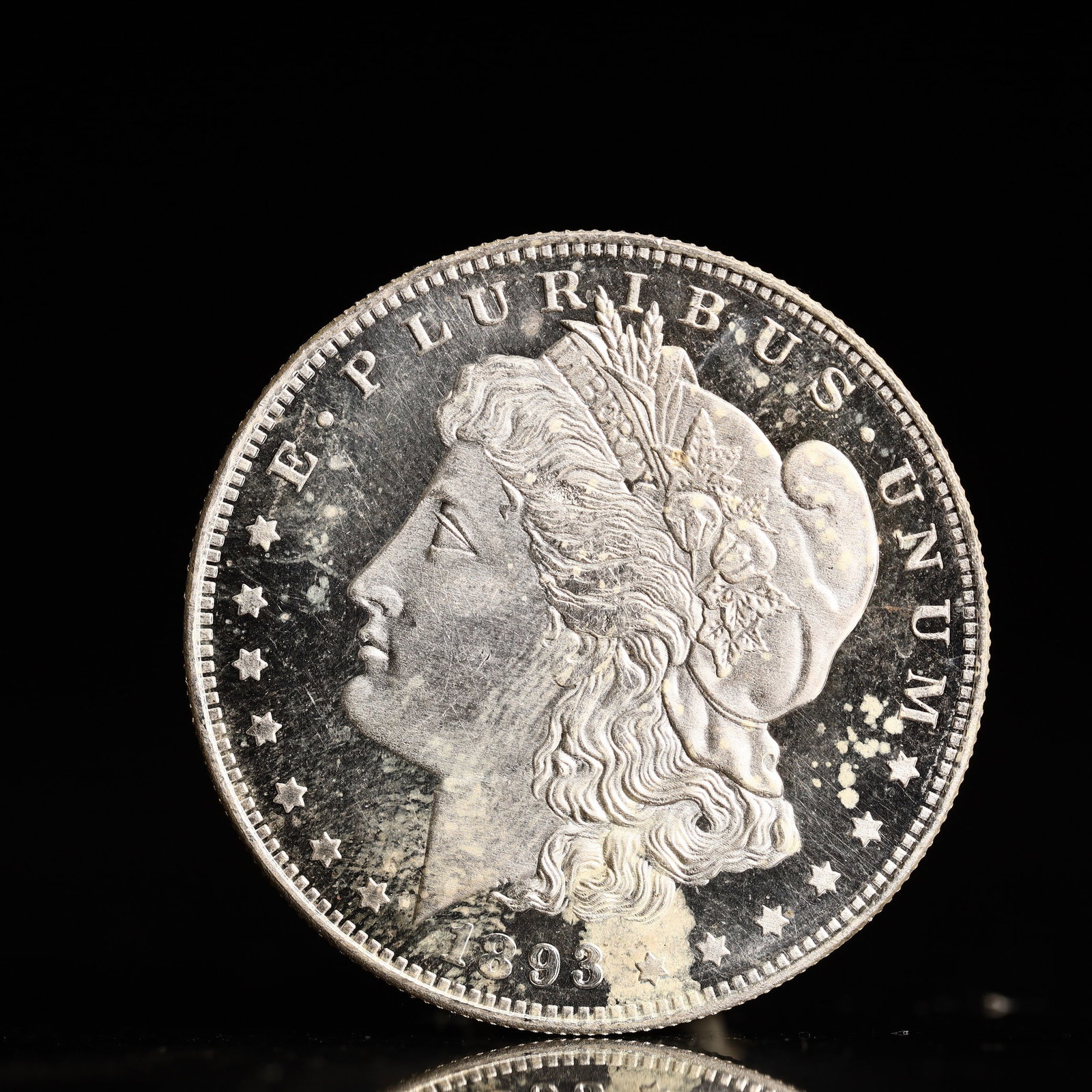 USA Morgan Dollar 1893 Coin: Obv: profile bust with date below and E PLURIBUS UNUM legend and stars around. Rev: eagle with In God we trust above within wreath with UNITED STATES OF AMERICA ONE DOLLAR legend. IN GOD WE TRUST /