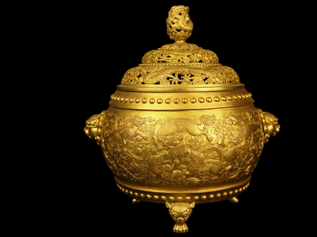 An Exquisite Gilt Bronze Auspicious Animal Pattern Beast-Ears Tripod Censer: An Exquisite Gilt Bronze Auspicious Animal Pattern Beast-Ears Tripod Censer,Qing Dynasty,China,with Qianlong Four-character Mark,Size:8.3inx8.3inx11.4in,Weight:3567g,铜鎏金瑞&#